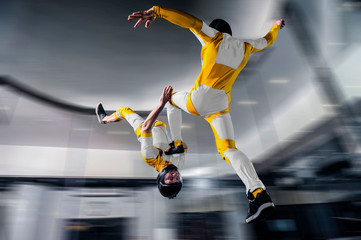 Plakat Risk. Brave men in parachute equipment. Skydiving is sport for extreme people. Flyer in white and yellow suit. The sky without borders.