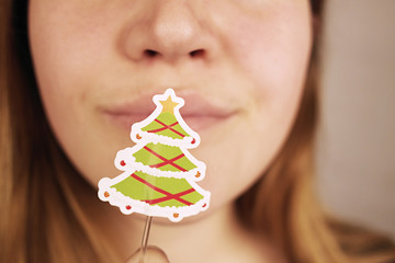 young, beautiful girl with a decorative Christmas tree
