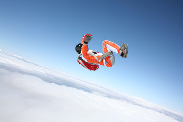 Risk. Brave men in parachute equipment. Skydiving is sport for extreme people. Flyer in orange...