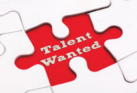 TALENT WANTED written on red background with white puzzle,conceptual