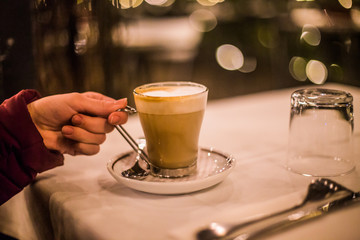 Cup of latte in a restaurant in Italy