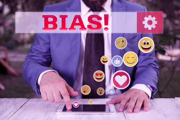 Conceptual hand writing showing Bias. Concept meaning inclination or prejudice for or against one...