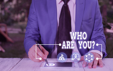 Conceptual hand writing showing Who Are You Question. Concept meaning asking about someone identity...