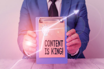 Writing note showing Content Is King. Business concept for marketing focused growing visibility non paid search results