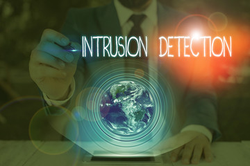 Conceptual hand writing showing Intrusion Detection. Concept meaning monitors a network or systems for malicious activity Elements of this image furnished by NASA