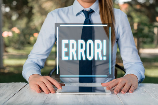 Text sign showing Error. Business photo text state or condition of being wrong in conduct judgement or program Female business person sitting by table and holding mobile phone