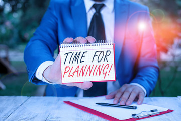 Obraz premium Conceptual hand writing showing Time For Planning. Concept meaning exercising conscious control spent on specific activities Man holds empty paper with copy space in front of him