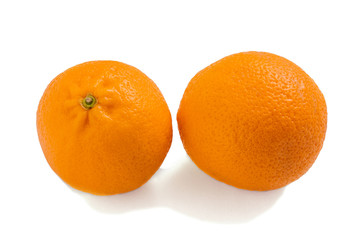 Two oranges isolated on a white background. Fresh citrus fruits.