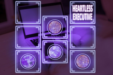 Conceptual hand writing showing Heartless Executive. Concept meaning workmate showing a lack of empathy or compassion Elements of this image furnished by NASA