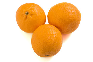 Three oranges isolated on a white background. Fresh citrus fruits.