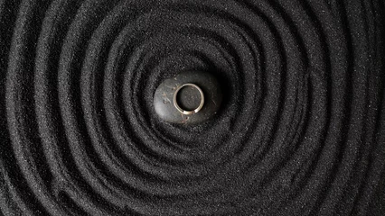 Printed roller blinds Stones in the sand Ring on dark stone with circle dark sand background