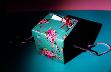 gift box with ribbon and bow on red background