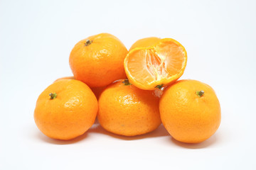 Fresh mandarin oranges on white background