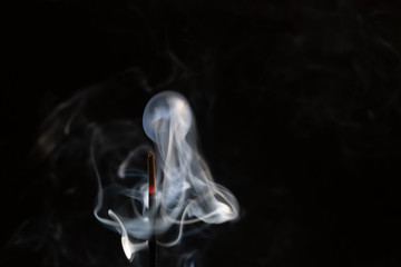 abstract background of smoke from incense stick close up with copy of space on black background