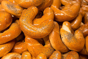 Sweet roll croissant with poppy seeds called Loupak. Filled frame texture. Sweet pastry from Czech republic, Europe.