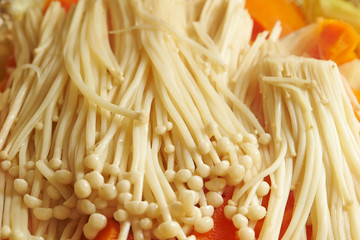 Enoki mushroom and carrot in homemade hot pot 