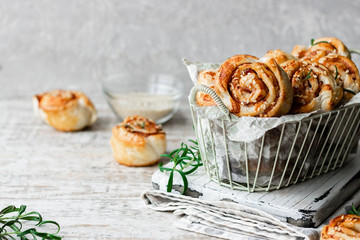 Unsweetened snails and puff pastry with bacon, sesame seeds and rosemary.