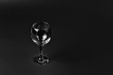 Empty wine glass on black background	