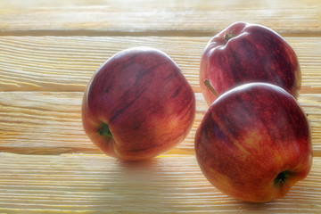 Three red apples close-up