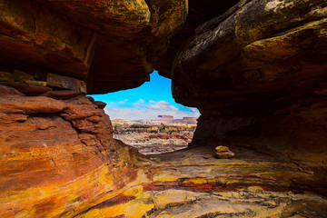 Mountain view through a natural hole in the rock