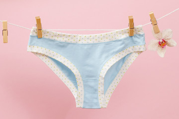 Beautiful women's cotton panties on pink background.