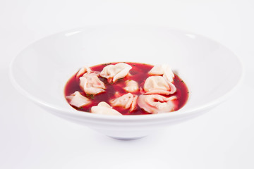 Polish Christmas Eve dish:clear borscht with dumplings (uszka)