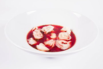 Polish Christmas Eve dish:clear borscht with dumplings (uszka)