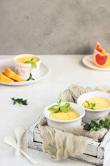 Obraz na płótnie Canvas Homemade delicious individual citrus souffle with mint. 
