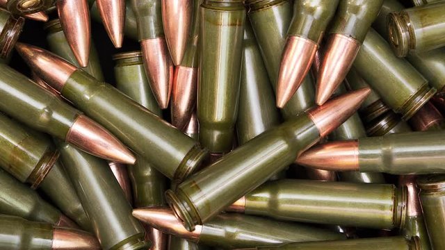 Seamless loop of rotating rifle ammunition