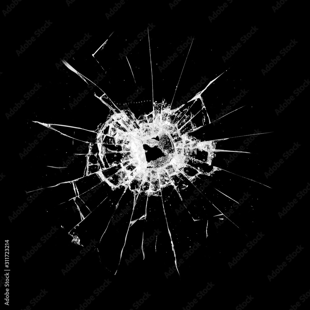 Poster glass with a hole and cracks isolated on a black background