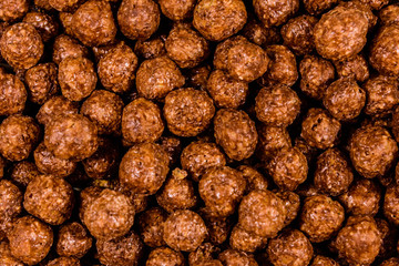 Texture of chocolate cereal balls for the background
