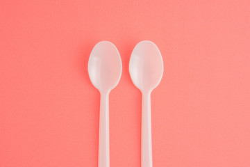 Plastic Spoons On Pink Background, White Plastic Spoons