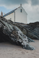 old building on rock cliff