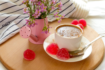 cup of coffee with cream and strawberries