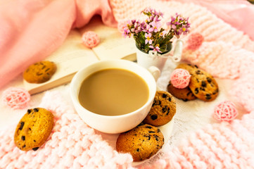 cup of tea and cookies on table