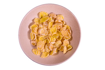 Ceramic plate with cornflakes isolated on a white background. Healthy eating