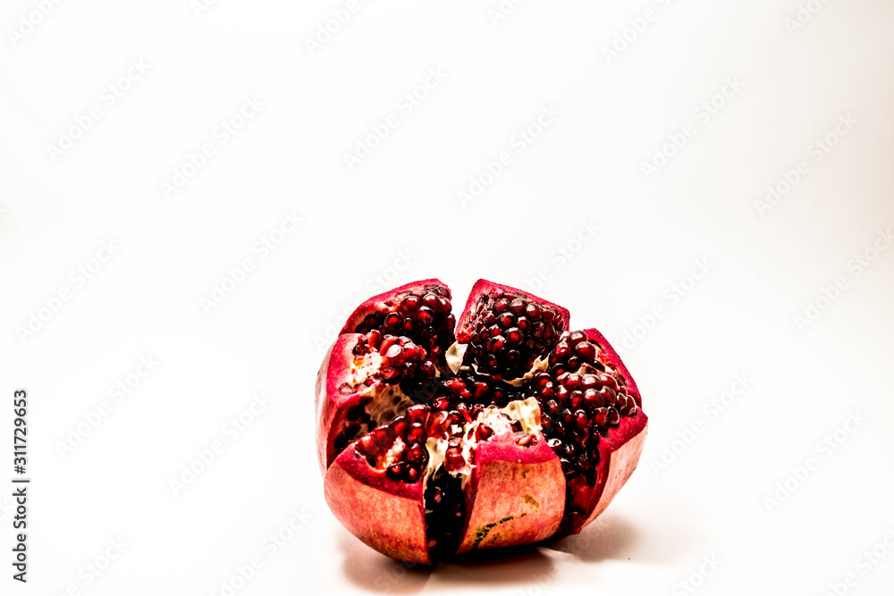 Wall mural pomegranate isolated at the white background