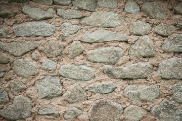 Rough stones in cement.