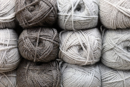 Background Of Rows Skeins Of Fluffy Wool Yarn For Knitting Different Warm Gray Colors