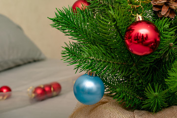 Christmas background. Branch of spruce tree. Christmas balls on the Christmas tree.