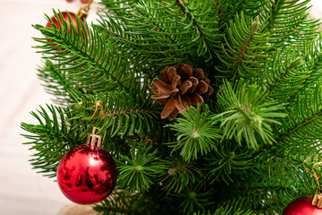 Obraz na płótnie Canvas Christmas background. Branch of spruce tree. Christmas balls on the Christmas tree.