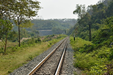 Fototapeta na wymiar perspective view railways from station to mountain in Thailand