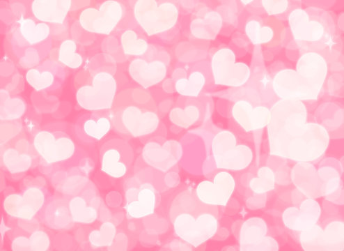 white heart shaped bokeh on pink pastel background