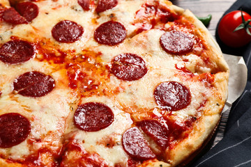 Hot delicious pepperoni pizza on table, closeup