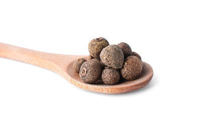 Spicy black pepper grains isolated on white