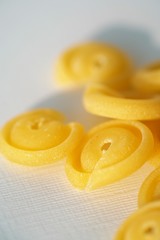 Top view on Italian messicani pasta shapes on white background