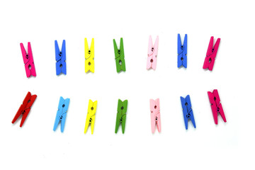 Many color wooden clip isolated white background - for hanging items - red blue pink green yellow...