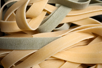 Closeup view of fresh raw tagliatelle pasta