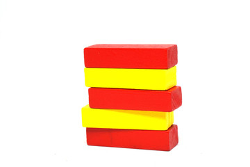 Wooden Kids Toys or jigsaw wooden for Develop children's skills arrange isolated on white background - red yellow color - Different - separate Concept 