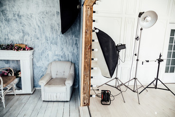 Interior of PhotoStudio flashes white grey background decor